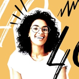 Image of a woman on a yellow background with the number 40 written in black ink and white ink. 