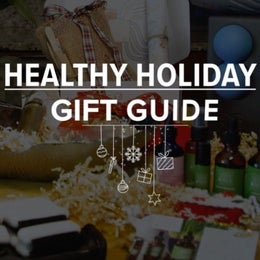 Image of a table with holiday gift baskets and the words “Healthy Holiday Gift Guide”