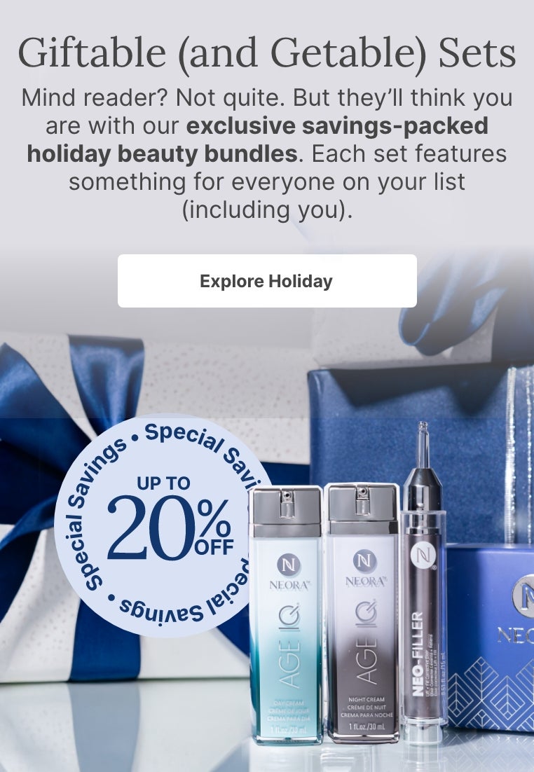 A bundle of Neora skincare products and a blue velvet Neora branded bag surrounded by festive gift boxes. Accompanying text mentions Neora’s newest exclusive holiday beauty bundles that are perfect for gifting to others or yourself.
