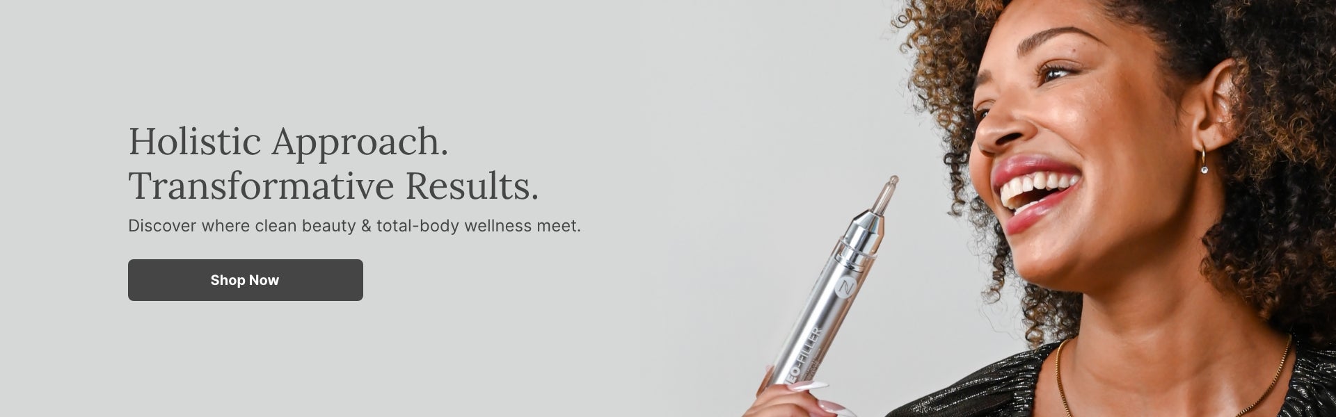 A smiling woman holding a tube of Neo-FILLER. Accompanying text mentions a Holistic Approach with Transformative Results. Shop now to discover where clean beauty & total-body wellness meet.