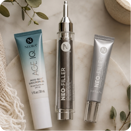 A product shot of Invisi-Bloc, Neo-FILLER, and a Neo-FILLER Lip Treatment tube displayed on a marbled display.