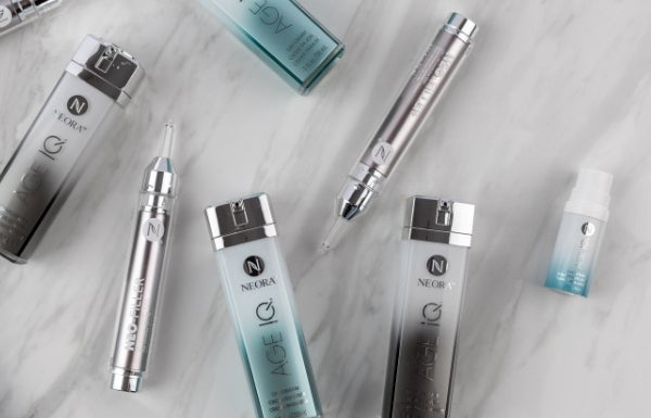 Various products in the New! Advanced Skincare Set spread out on a marble table.