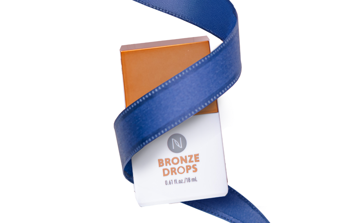 A Neora Bronze Drops container wrapped in blue ribbon.