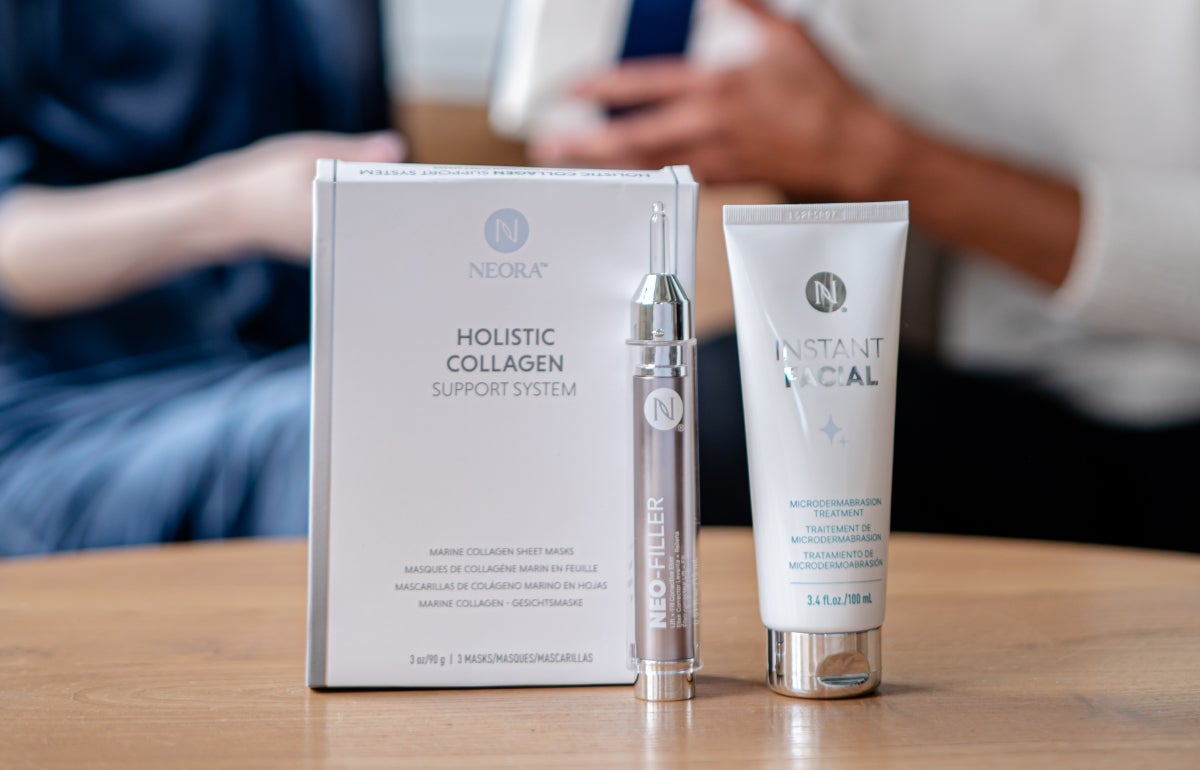 People exchanging a gift box behind a bundle of Marine Collagen Sheets, Neo-FILLER, and Instant Facial.