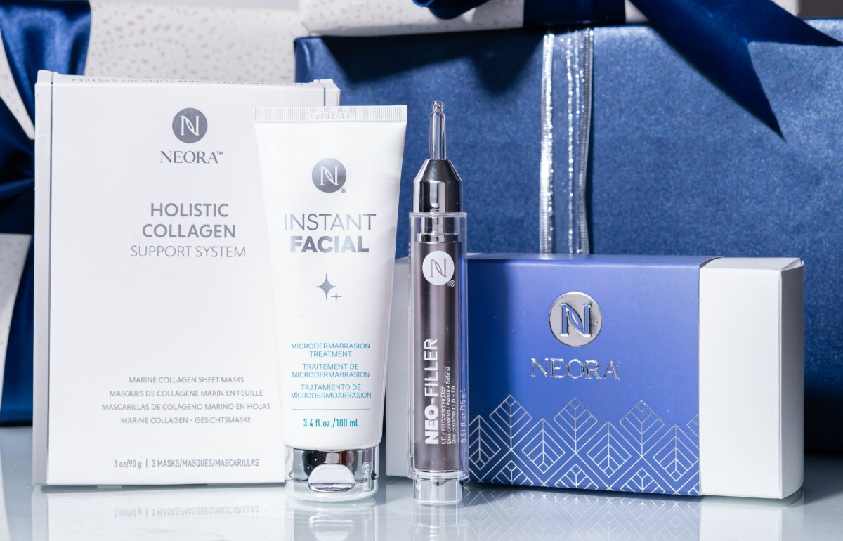 A bundle of Neora skincare products, which include Instant Facial, Neo-FILLER, and a box of Marine Collagen Sheet Masks, surrounded by festive gif boxes.