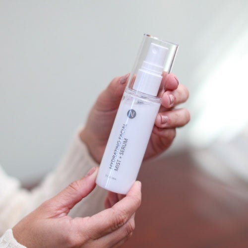 Woman holding Neora’s Holiday Hot List must-have, Hydrating Facial Mist.