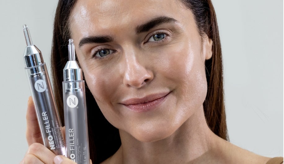 Featured is a woman holding up two of Neora’s Neo-Filler product.