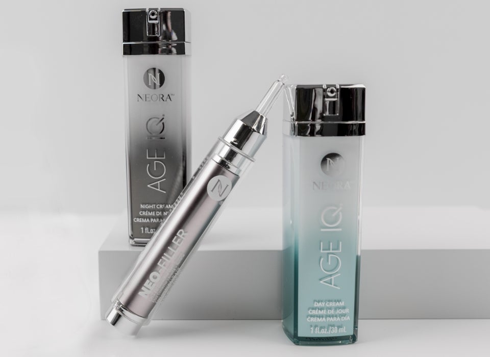A group shot of Age IQ Night Cream, Age IQ Day Cream, and Neo-Filler bottles.