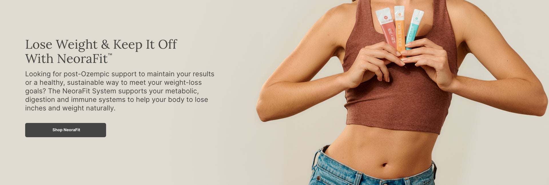 A woman in a red tank top holds up NeoraFit™ sachets to her chest.