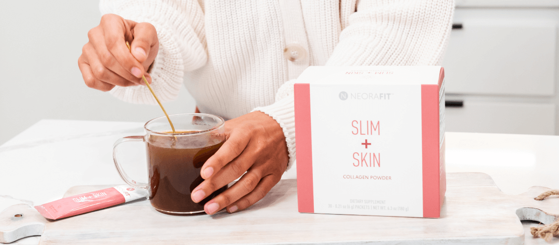 A woman mixing a drink with NeoraFit Slim + Skin powder.