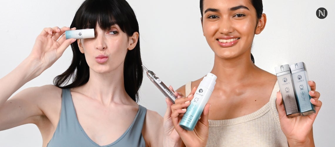 Two women posing with the Advanced Skincare Set.