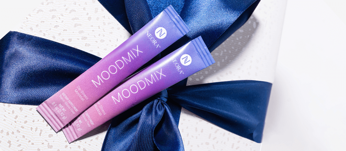 Packets of MOODMIX placed on top of a gift box.