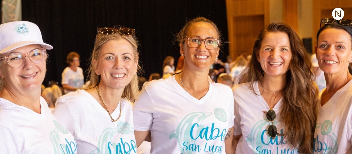 A group of female Neora Brand Partners posing for a picture.