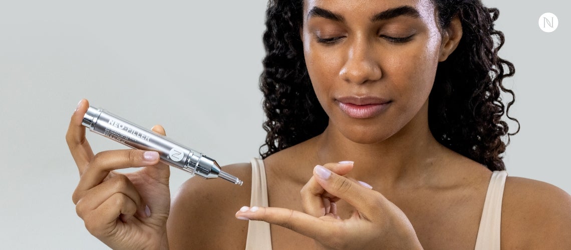 A woman applying Neo-Filler to her finger.