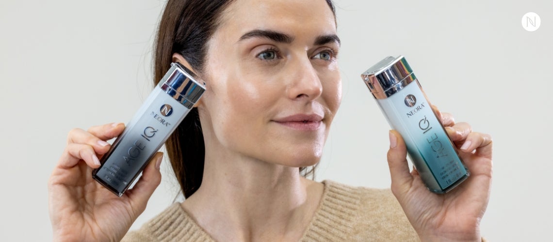 A woman holding Age IQ Day Cream and Night Cream bottles.