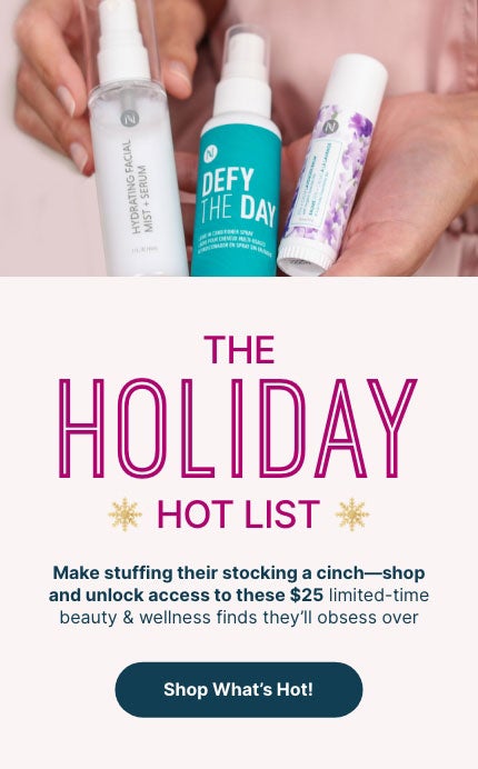 Woman holding Neora’s Holiday Hot List must-haves: Lip Plumping Serum, Hydrating Facial Mist and Zen + Calm Lavendar Balm. 
