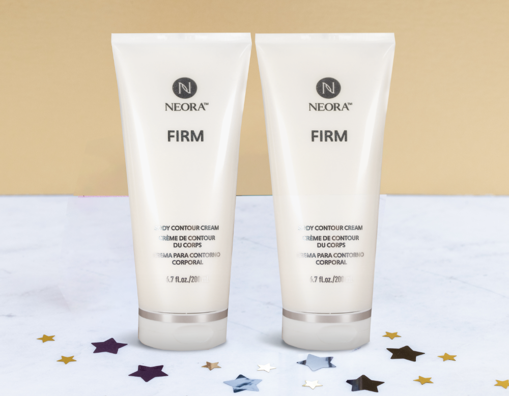 Neora’s LashLush tube and Lip Plumping Serum are pictured next to a pink purse mirror on a white marble table. Surrounding the products are glitter stars. And text that says “save 15%” and “free gift!”