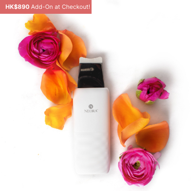 Neora’s NEW Ultrasonic Skin Renewal Facial Device amid a rose bouquet