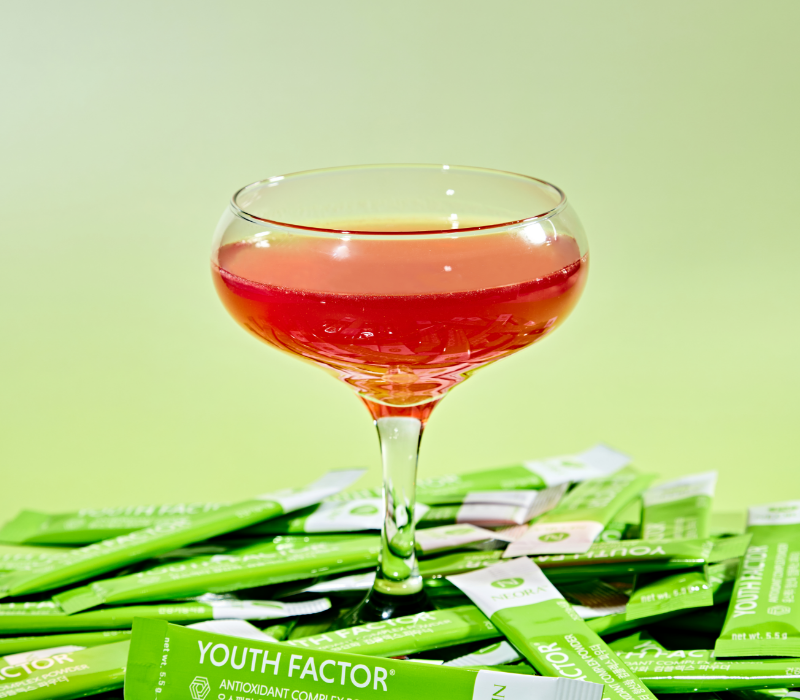 Neora Youth Factor® Superfood & Antioxidant (Powder) pictured with watermelon