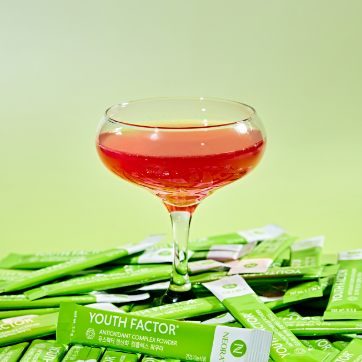 Neora Youth Factor® Superfood & Antioxidant (Powder) pictured with watermelon