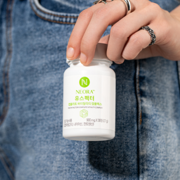 Neora Youth Factor® Vitality Complex bottle and pills shown pictured with berries