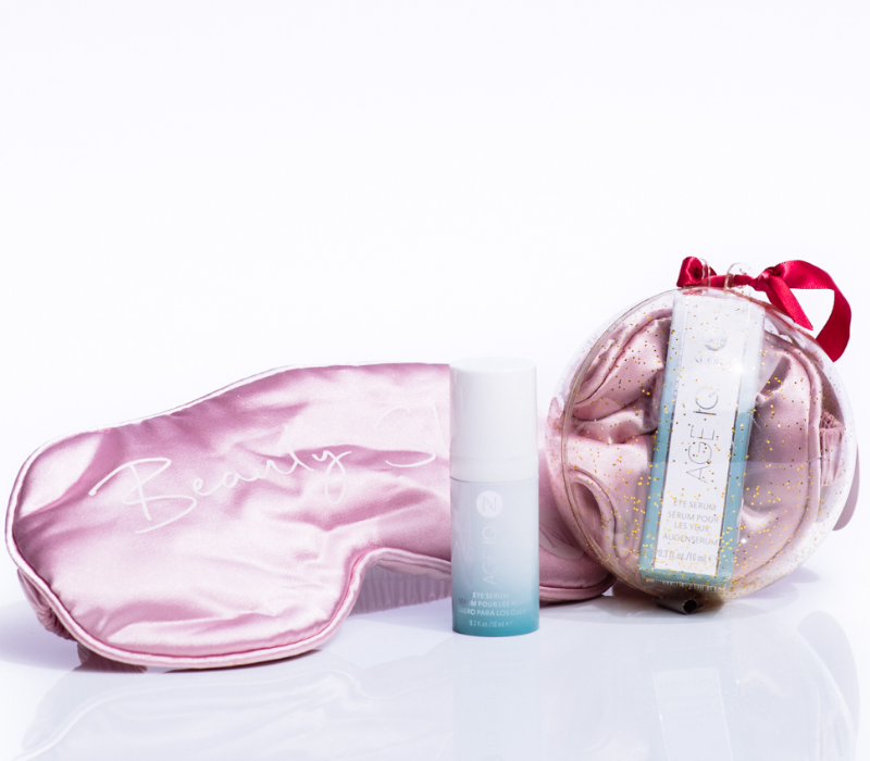 Neora’s hottest holiday must-have, the All Eyes on You Set, which includes Age IQ® Eye Serum and FREE Eye Mask in a special glitter ornament.