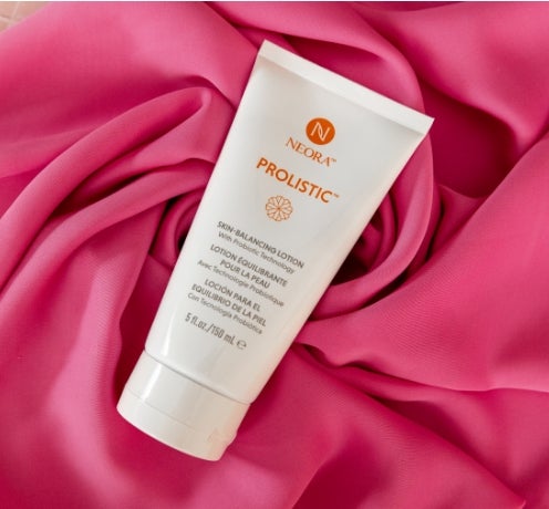 Prolistic Lotion laying on pink fabric
        